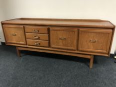 A late twentieth century teak Long John sideboard