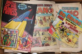 A box containing assorted Beano and Victor comics,