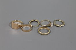 Two 9ct gold bands, a pair of 9ct gold earrings,