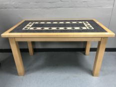 A contemporary rectangular beech table,