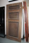 A twentieth century oak panelled door