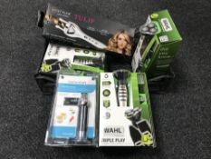 A crate containing three Wahl Triple Play Shavers,
