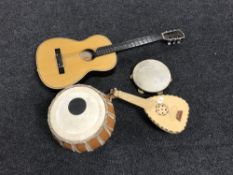 An acoustic guitar, a tambourine,