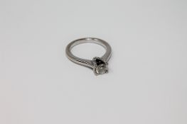A diamond solitaire ring, by Vera Wang, the brilliant cut stone weighing an estimated 0.