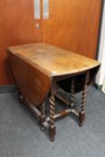 An oak barley twist gate leg table