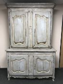 An antique French painted housekeepers cabinet
