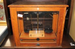 A mid twentieth century Brady and Martin Ltd chemist's scales in box with weights.