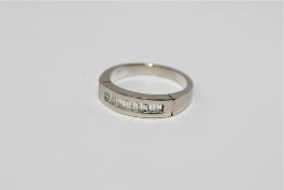 An 18ct gold diamond half eternity ring, approximately 0.