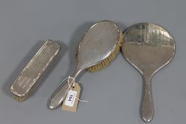 A sterling silver backed hand mirror,