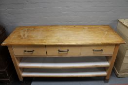 A contemporary Ikea pine topped kitchen preparation table fitted with three drawers and shelves