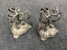 A pair of early 20th century plated metal stands with grape and leaf decoration