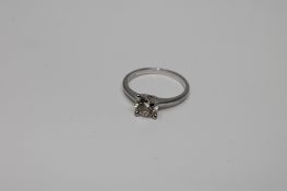 A platinum diamond solitaire ring, approximately 0.72ct, size H.