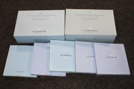 Two boxed Wedgwood A Celebration of the Millennium cup and saucer sets,