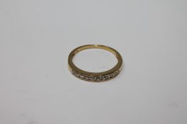 A silver gilt half eternity ring set with cz