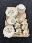 Fifty two pieces of Meakin dinnerware