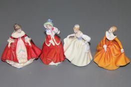 Four Royal Doulton miniature figurines, including 'Southern Belle', 'Christmas Morning',