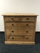An antique pine five drawer chest