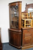 A mahogany corner display cabinet
