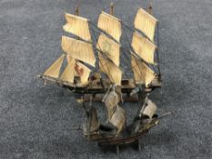 Two model galleons on stands