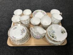 A tray containing three English part china tea services, two Royal Grafton,