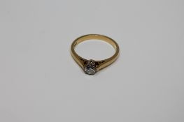 An 18ct gold diamond solitaire ring, approximately 0.25ct, size M.