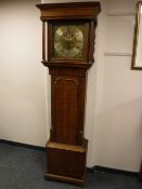 A nineteenth century oak long cased clock, with brass moon phase dial,