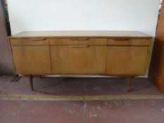 A teak cocktail sideboard