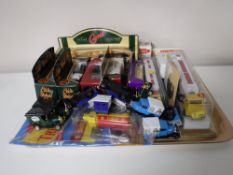 A tray of die cast vehicles - Days Gone road transporter, Eddie Stobart vans,