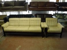 A wood framed three seater settee and armchair upholstered in a beige button fabric