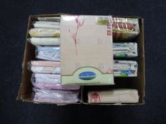 Two boxes containing new bedding