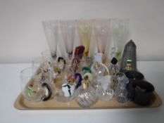 A tray containing a craftsman pewter sugar sifter, two antique pewter mugs, plated napkin rings,