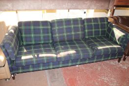 A three seater settee upholstered in a tartan fabric