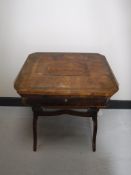 A 19th century inlaid sewing table