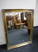 A gilt framed overmantel mirror
