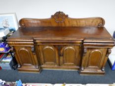 A Victorian mahogany four door inverted breakfront sideboard