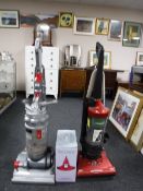 A Dyson DC14 upright vac together with a Samsung upright vac and a boxed bed cleaner