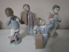 Four Nao figures of boys,