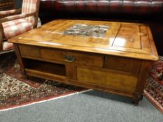 A Barker and Stonehouse burr walnut and marble topped storage coffee table,
