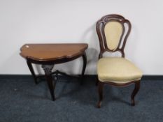 An antique mahogany dining chair together with a shaped hall table