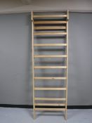 A pine wall mounted towel rail