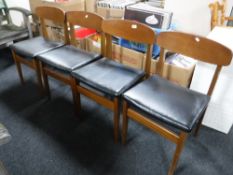 A set of four late twentieth century teak dining chairs