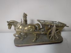 A large brass figure - farmer with horse and cart