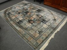 A Ghom design carpet, with compartmentalised central field,