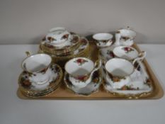 A tray containing twenty eight pieces of Royal Albert Country Roses china