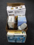 A box of Coopers jump starter, Bosch sander and hammer drill, Powering charge,