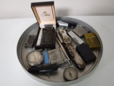 A tray containing assorted lighters including a boxed Calbri lighter,