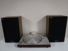 A Bang & Olufsen Beogram 1202 turntable, together with a Pioneer amp,