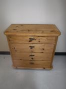 An antique pine four drawer chest