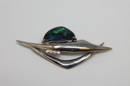 An 18ct white gold opal and diamond brooch, 9.