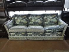 A three seater settee upholstered,